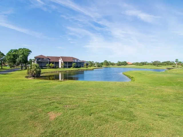 a view of a large body of water with a building in the background