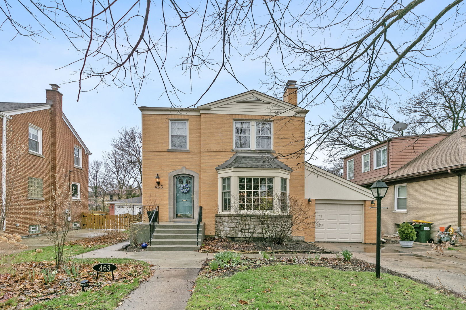 463 Longcommon Road Riverside, IL 60546 - Photo 1 of 36 a front view of a house with garden