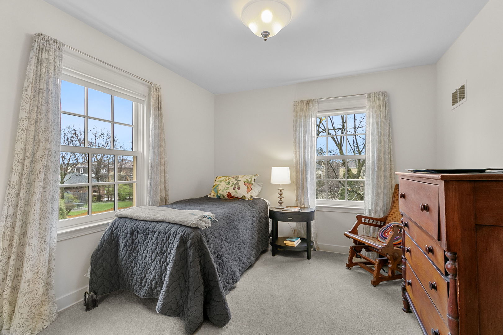 463 Longcommon Road Riverside, IL 60546 - Photo 17 of 36 a bedroom with a bed and large windows