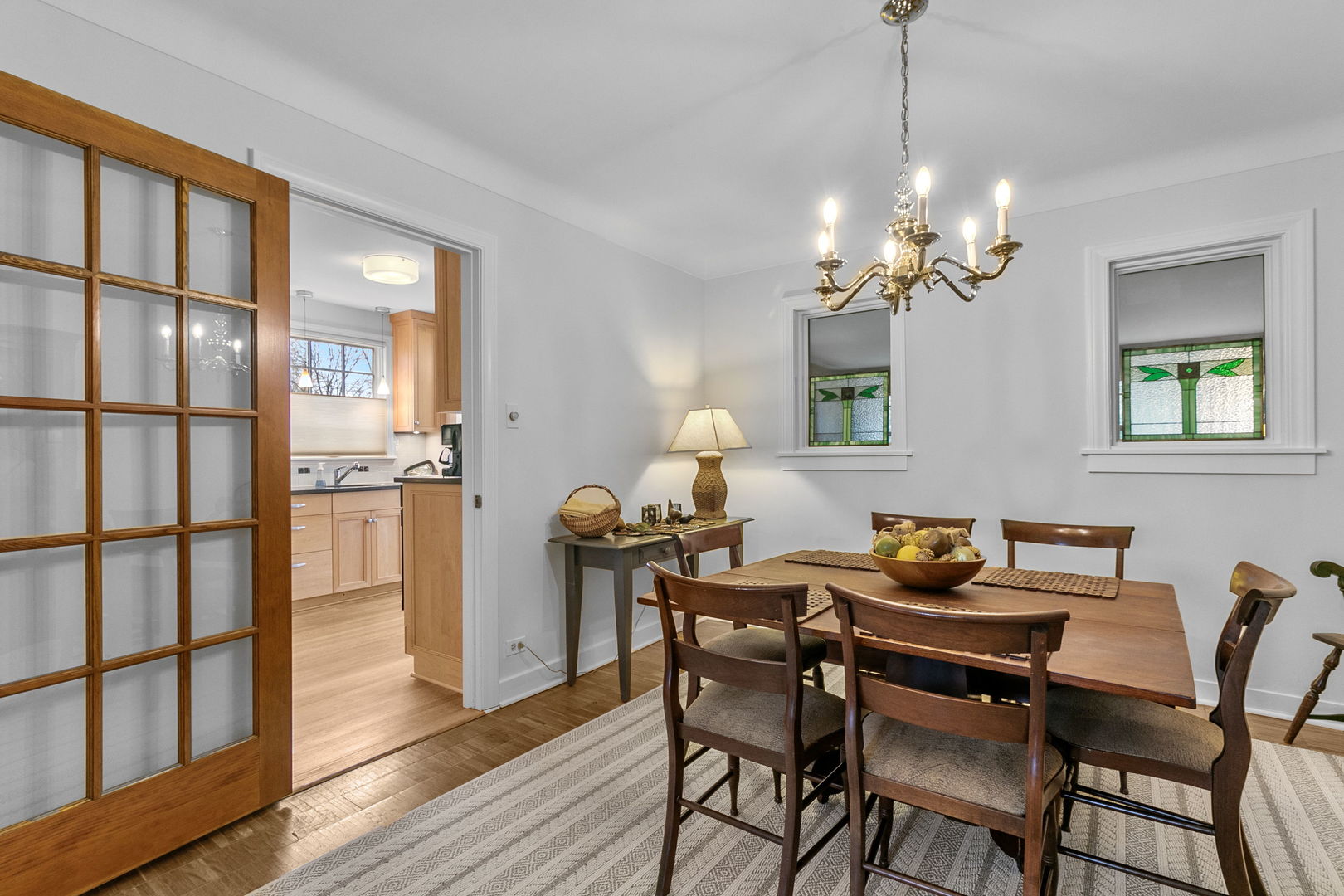 463 Longcommon Road Riverside, IL 60546 - Photo 6 of 36 a dining room with furniture a chandelier and wooden floor