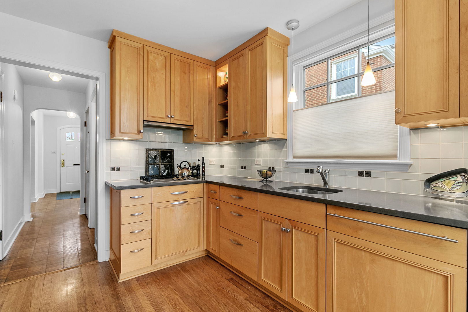463 Longcommon Road Riverside, IL 60546 - Photo 7 of 36 a kitchen with stainless steel appliances granite countertop a stove a sink and white cabinets with wooden floor