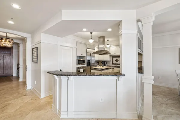 a kitchen with stainless steel appliances granite countertop a stove and a sink