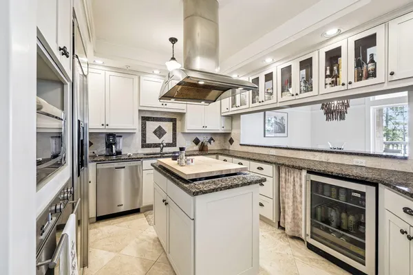 a kitchen with stainless steel appliances granite countertop a stove and a sink
