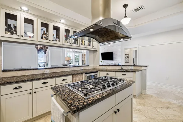 a kitchen with a refrigerator stove and sink