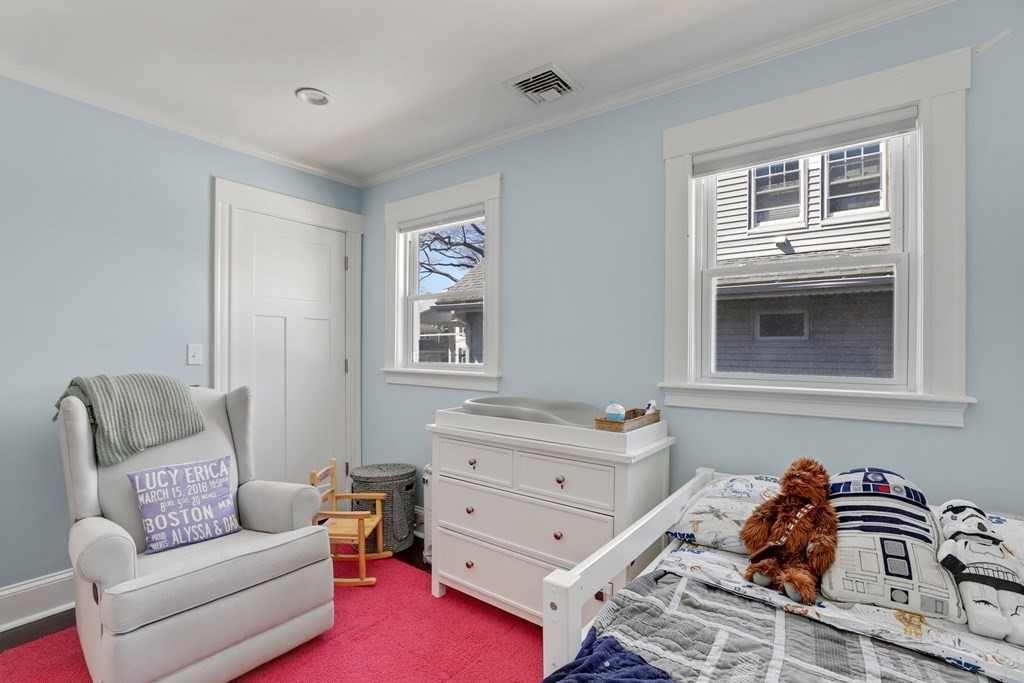 7-9 Goodway Road, Unit 2 Boston, MA 02130 - Photo 18 of 33 a bedroom with a bed and a couch