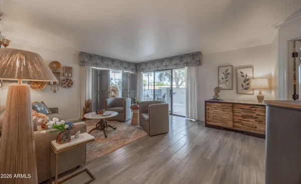 a room with furniture or wooden floor and a large window