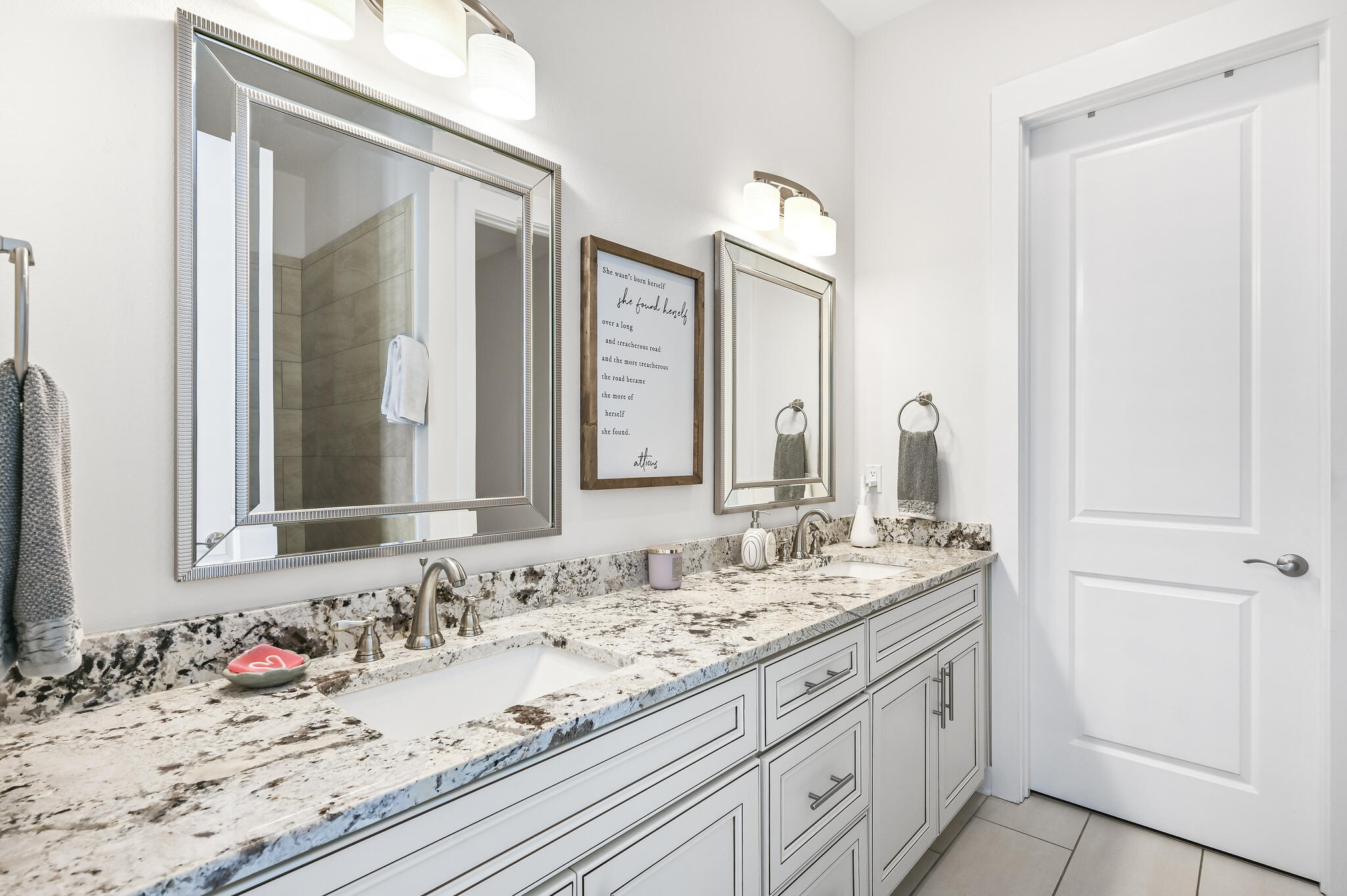 995 Airport Road, Unit 13 Destin, FL 32541 - Photo 13 of 34 a bathroom with a granite countertop sink and a mirror