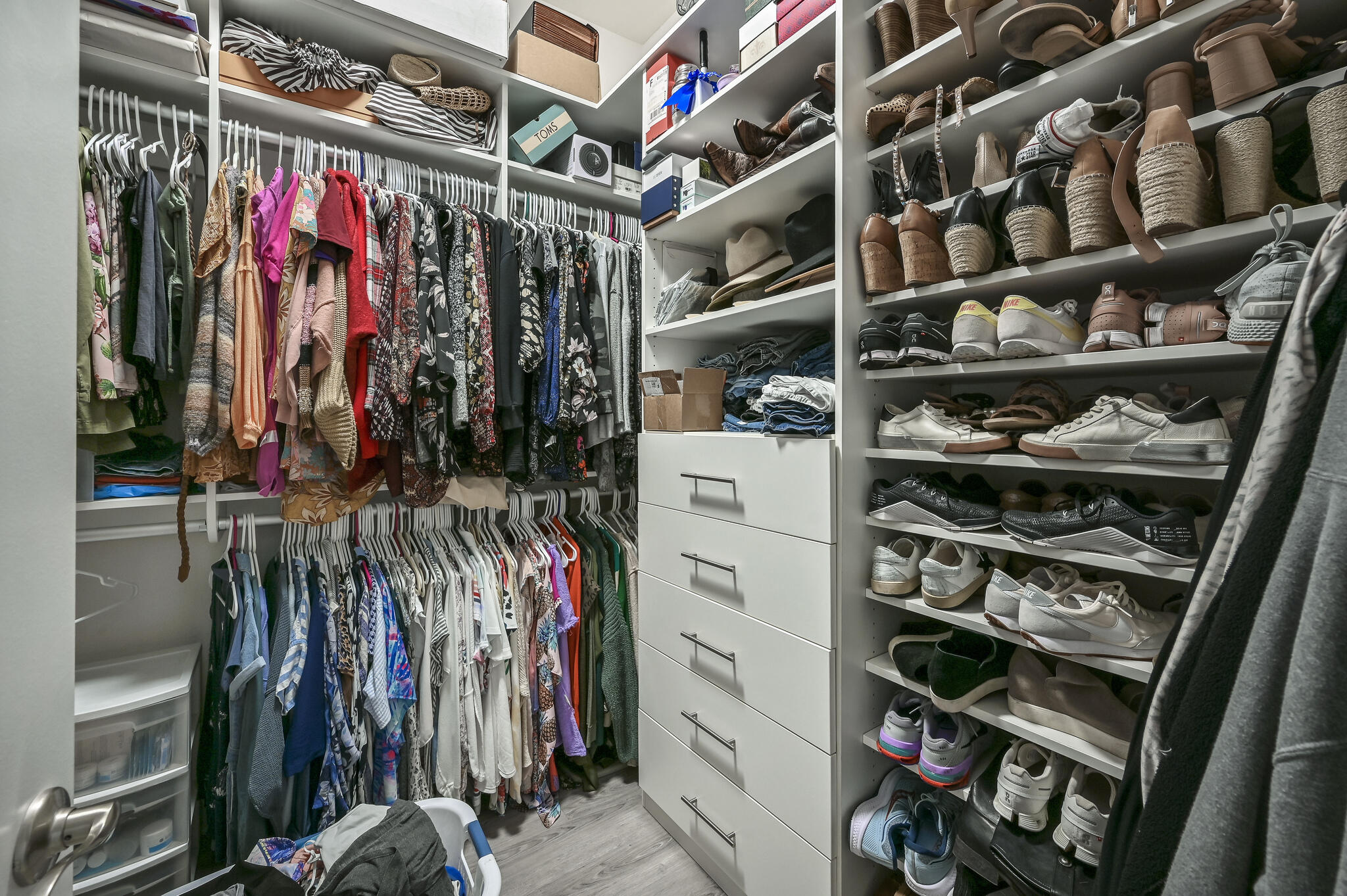 995 Airport Road, Unit 13 Destin, FL 32541 - Photo 15 of 34 a view of walk in closet with clothes and shoes