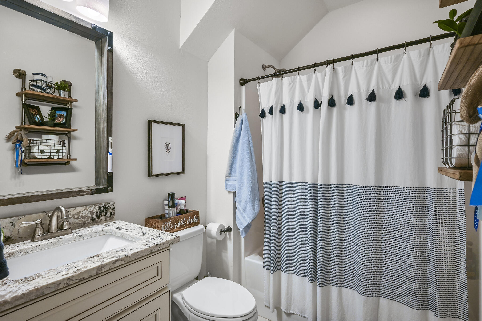 995 Airport Road, Unit 13 Destin, FL 32541 - Photo 16 of 34 a bathroom with a granite countertop sink toilet and shower