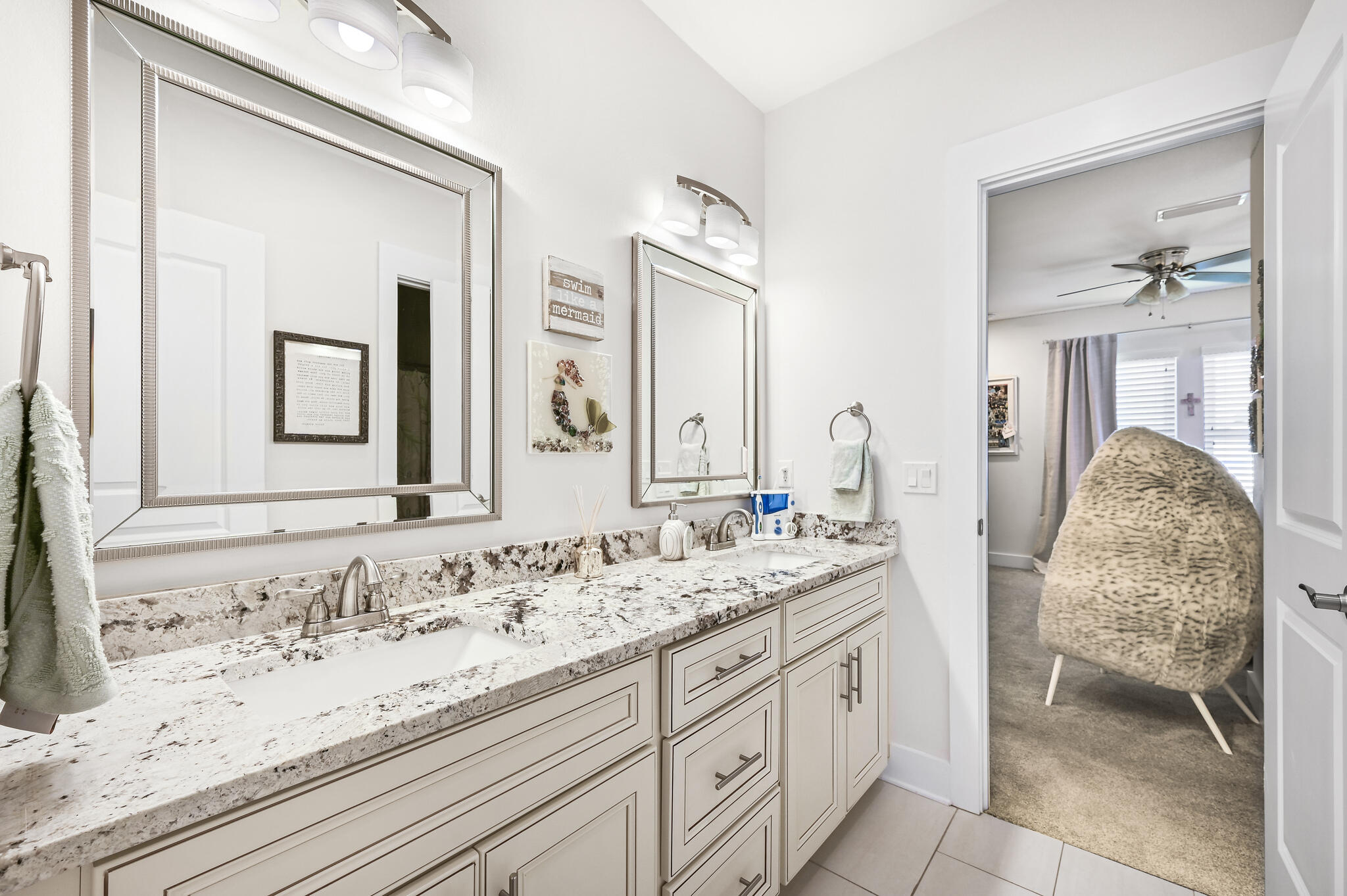 995 Airport Road, Unit 13 Destin, FL 32541 - Photo 23 of 34 a bathroom with double sink and a mirror