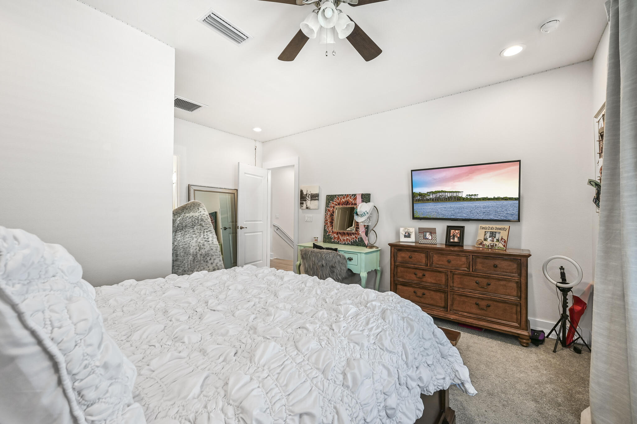 995 Airport Road, Unit 13 Destin, FL 32541 - Photo 25 of 34 a bedroom with a bed and a dresser