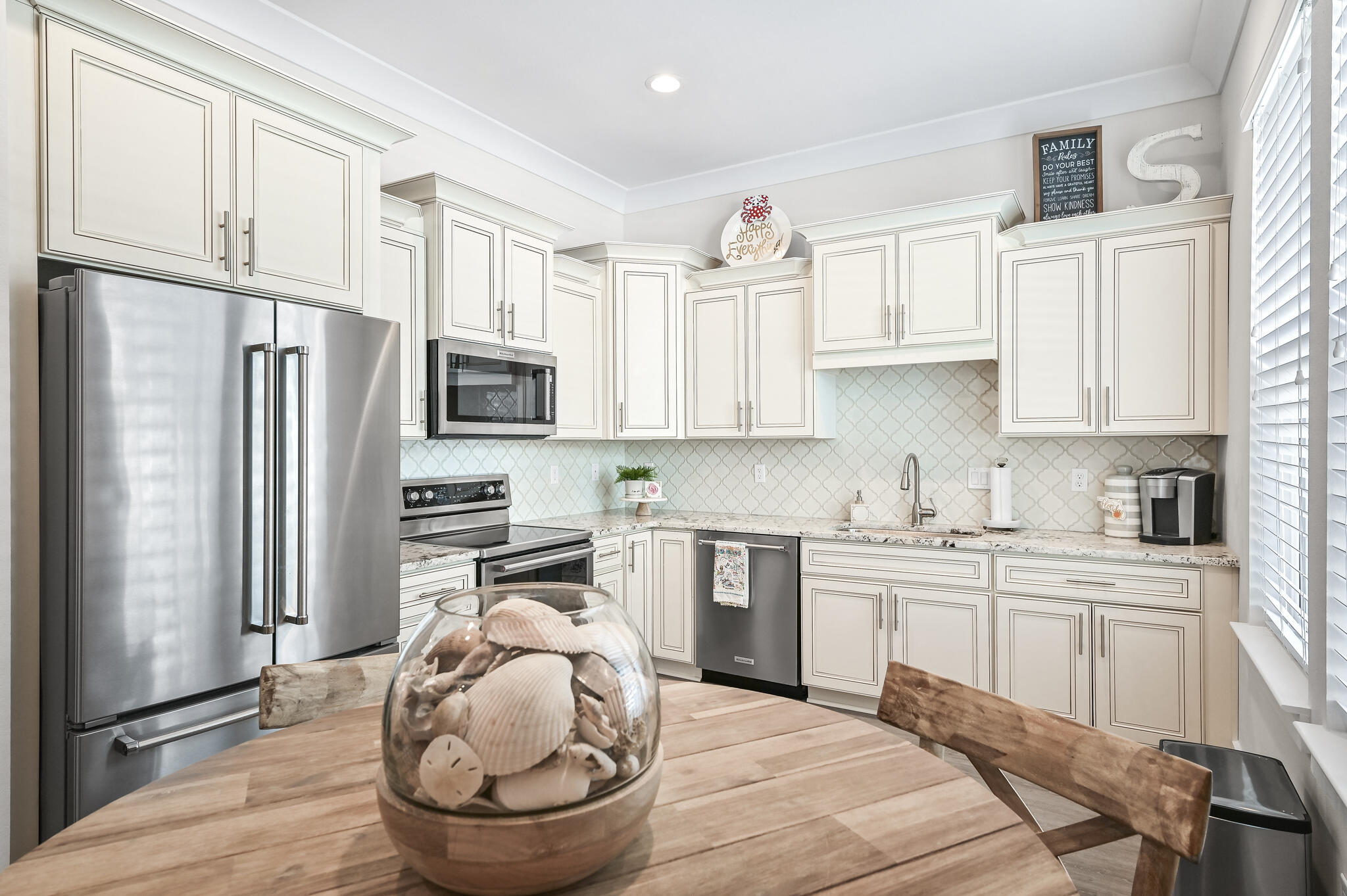 995 Airport Road, Unit 13 Destin, FL 32541 - Photo 7 of 34 a kitchen with a refrigerator sink and cabinets