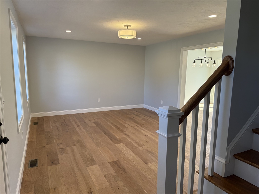 3 Jennifer Circle Bridgewater, MA 02324 - Photo 4 of 9 wooden floor in an empty room with a window