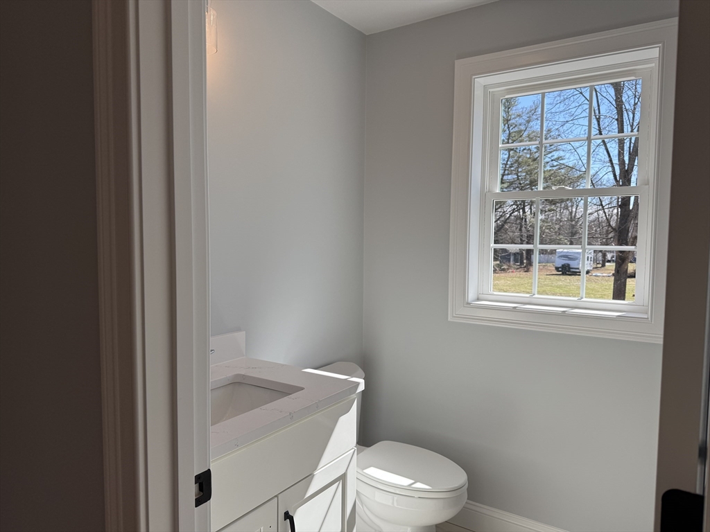 3 Jennifer Circle Bridgewater, MA 02324 - Photo 5 of 9 a white toilet sitting next to a window