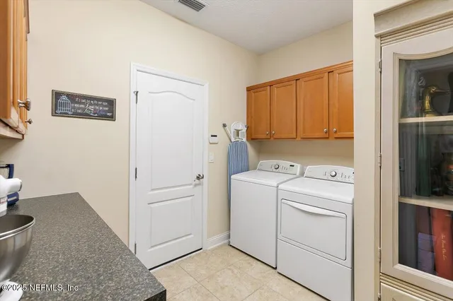 a view of storage and utility room with washer and dryer