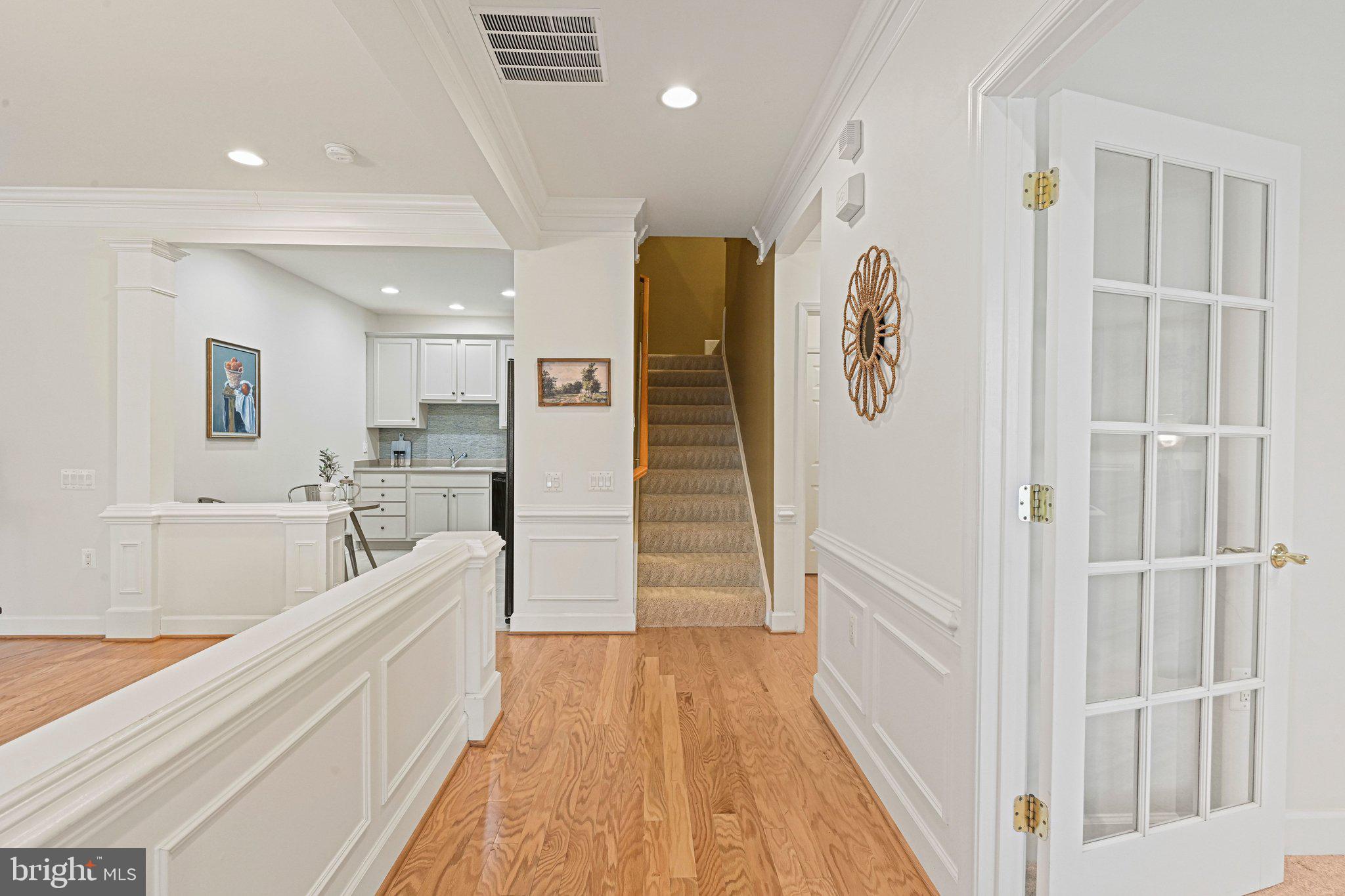 44482 Maltese Falcon Square Ashburn, VA 20147 - Photo 7 of 71 a view of a kitchen with a sink and wooden floor
