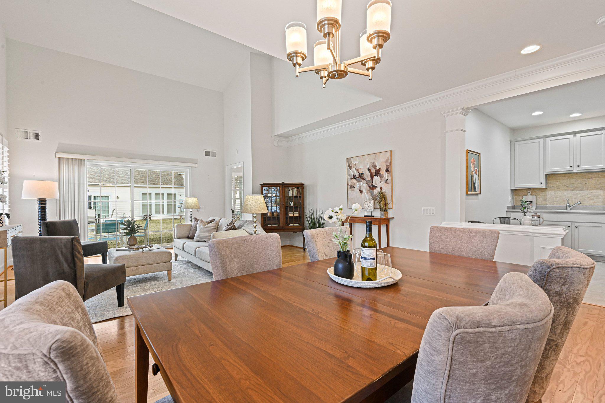 44482 Maltese Falcon Square Ashburn, VA 20147 - Photo 69 of 71 a living room with furniture kitchen view and a chandelier