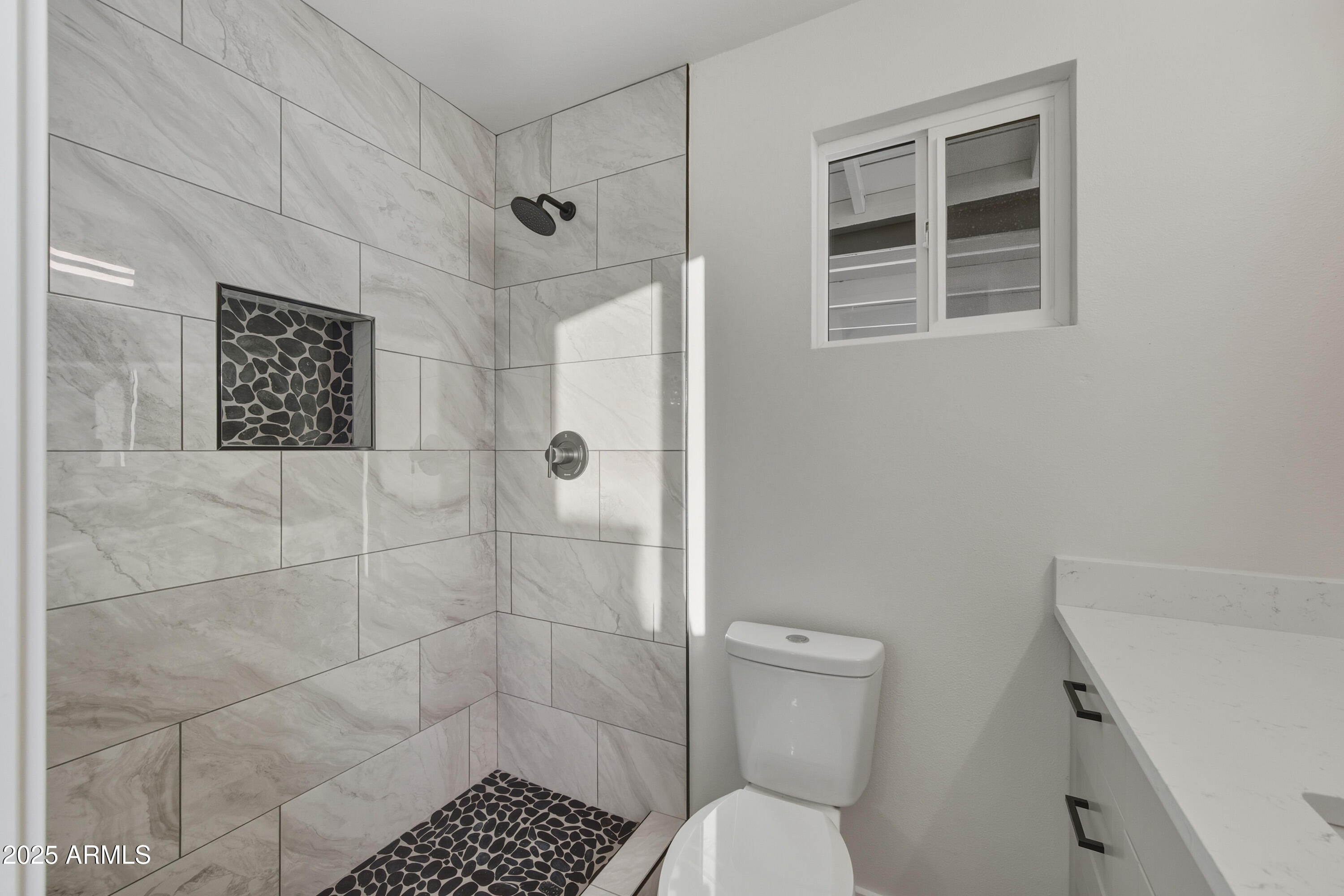 3410 West Pershing Avenue Phoenix, AZ 85029 - Photo 16 of 33 a bathroom with a toilet and a shower