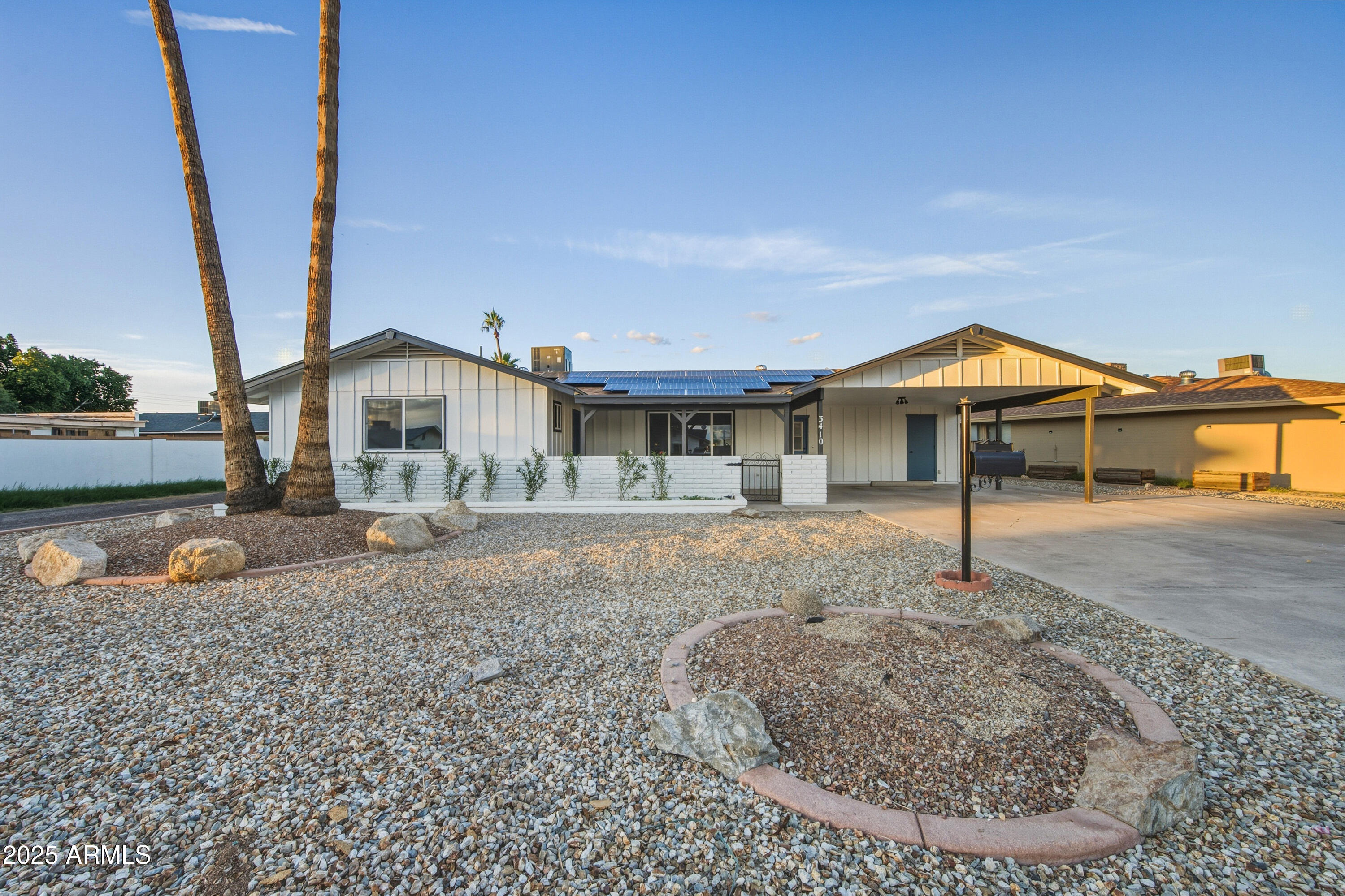 3410 West Pershing Avenue Phoenix, AZ 85029 - Photo 2 of 33 a view of a house next to a yard