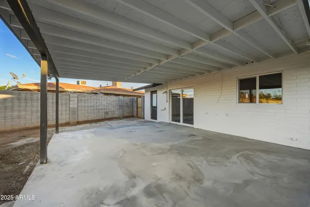 a view of empty room with wooden ceiling