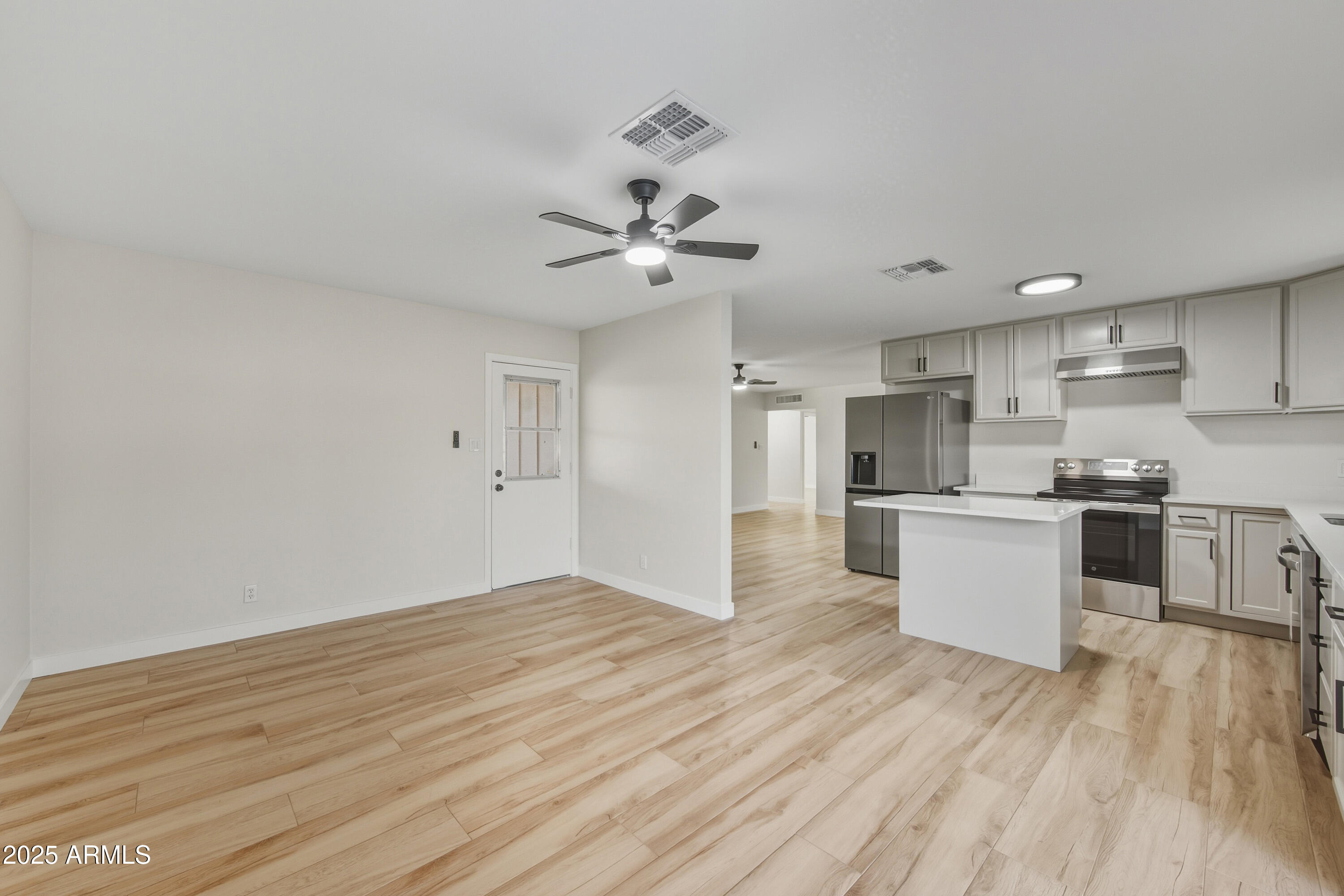 3410 West Pershing Avenue Phoenix, AZ 85029 - Photo 3 of 33 a view of kitchen with refrigerator microwave and stove