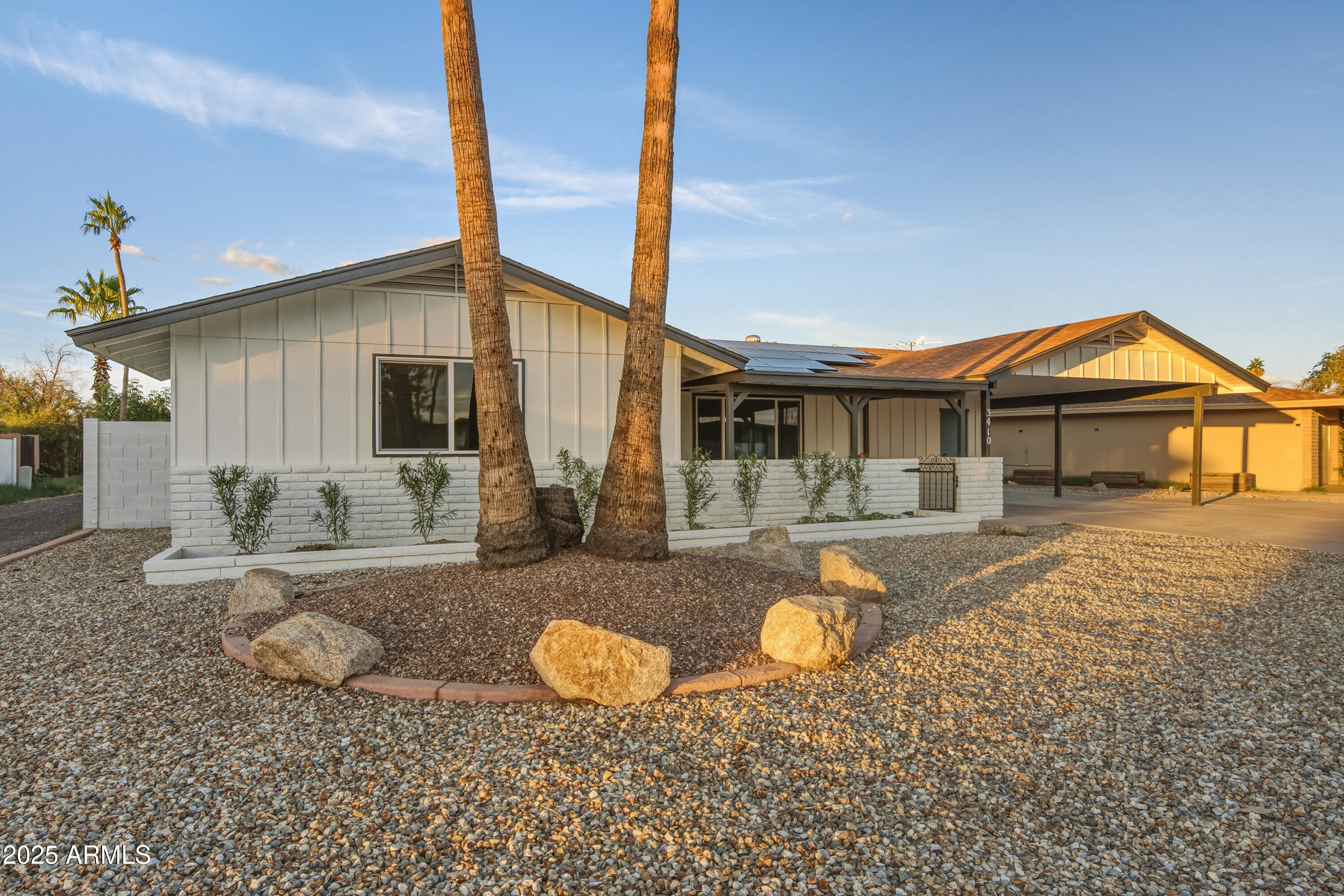 3410 West Pershing Avenue Phoenix, AZ 85029 - Photo 32 of 33 a view of a house with backyard and sitting area