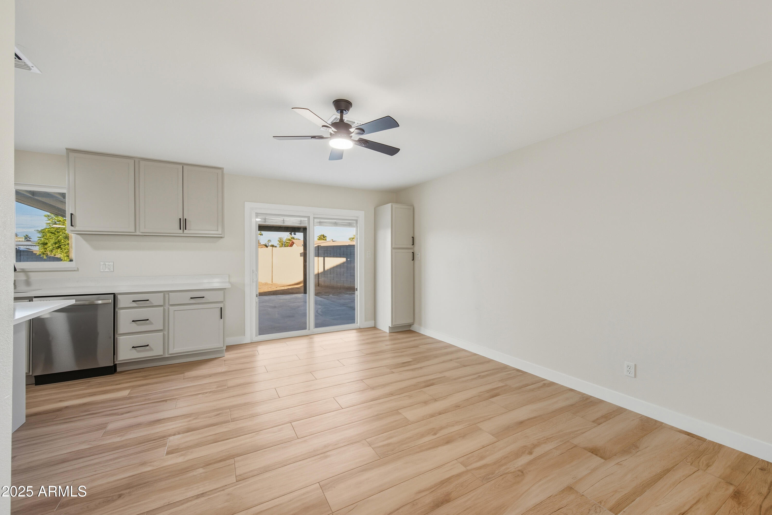 3410 West Pershing Avenue Phoenix, AZ 85029 - Photo 7 of 33 a view of a kitchen with a sink and a stove top oven
