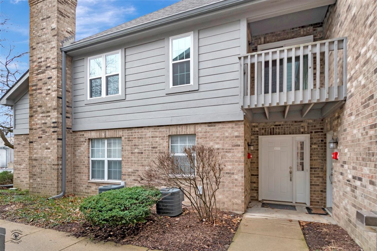 43 Foxcroft Road, Unit 219 Naperville, IL 60565 - Photo 2 of 19 a front view of a house with entryway