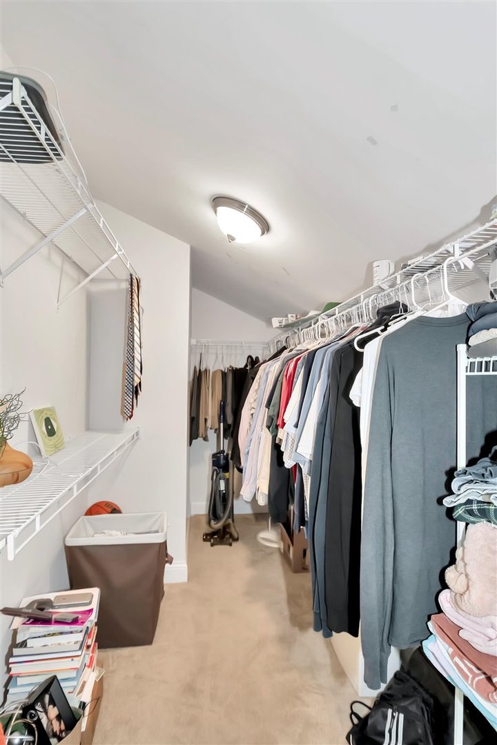 43 Foxcroft Road, Unit 219 Naperville, IL 60565 - Photo 13 of 19 a view of walk in closet with clothes and shoes