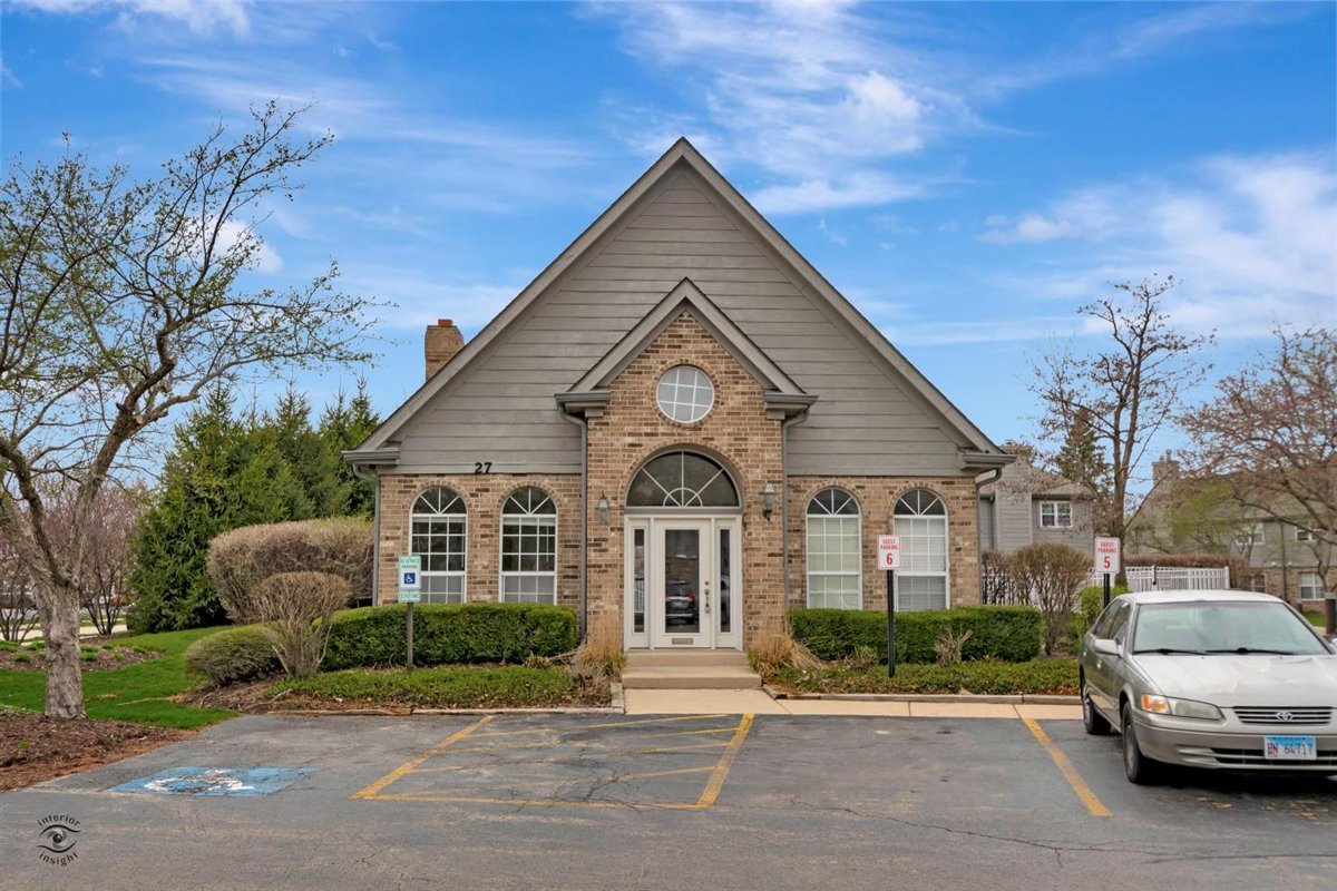 43 Foxcroft Road, Unit 219 Naperville, IL 60565 - Photo 18 of 19 a front view of a house with a garden