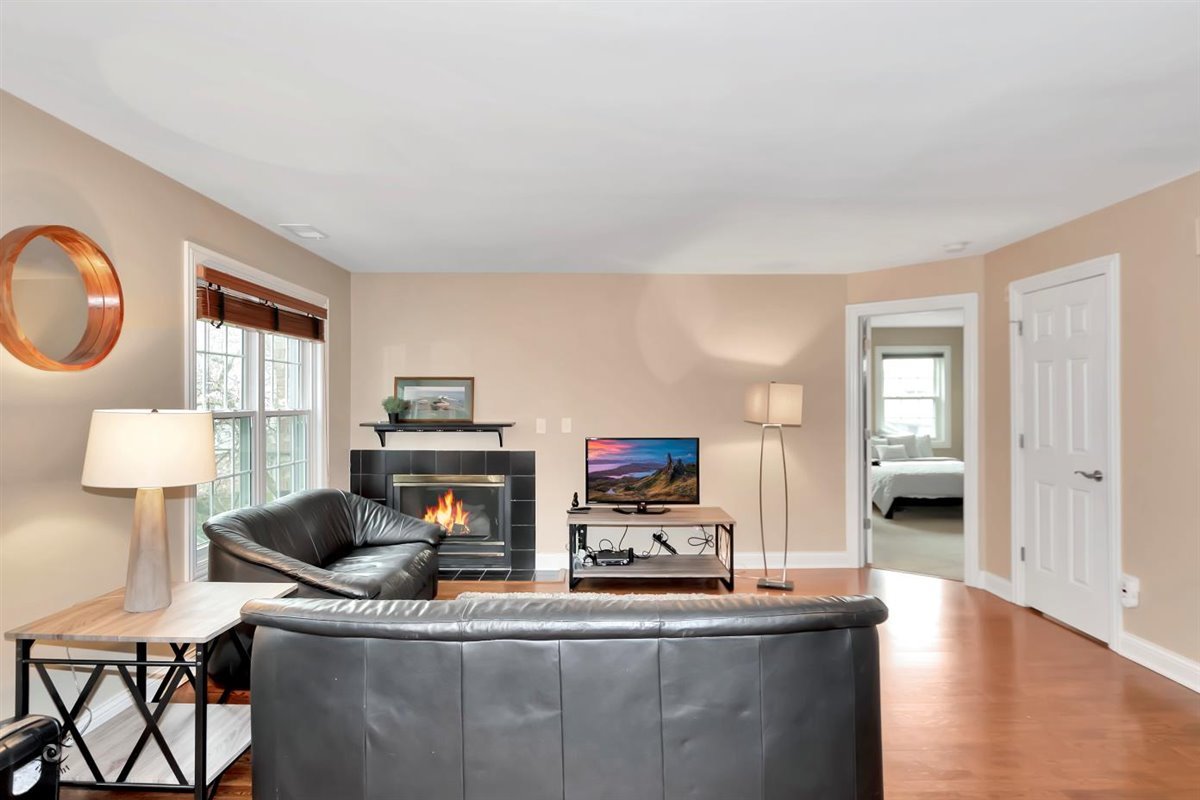 43 Foxcroft Road, Unit 219 Naperville, IL 60565 - Photo 4 of 19 a living room with furniture and a wooden floor