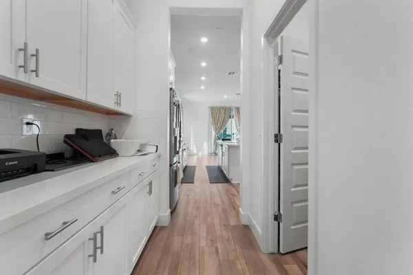 a view of a kitchen from the hallway