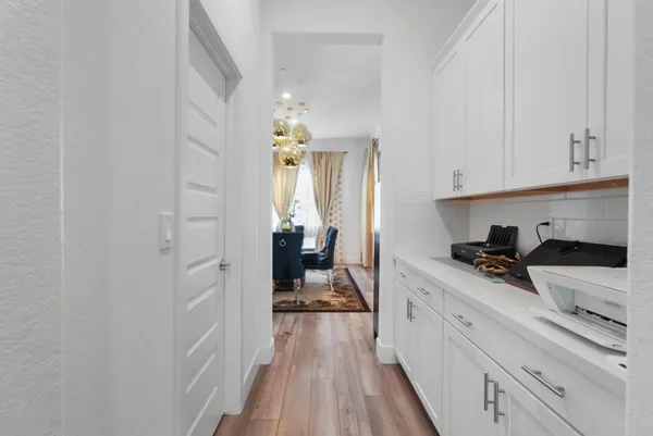 a kitchen with cabinets and a stove
