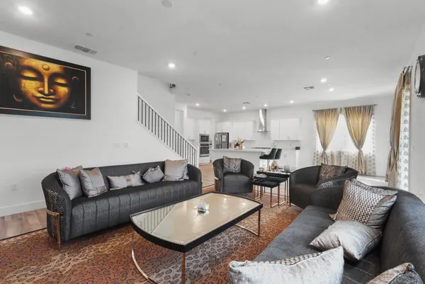 a living room with furniture and a large window