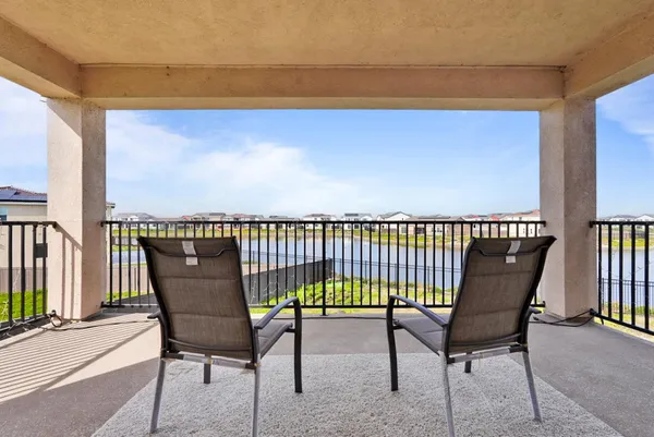 a view of a chairs and table in the patio