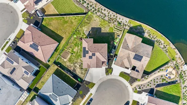 an aerial view of a house with a garden