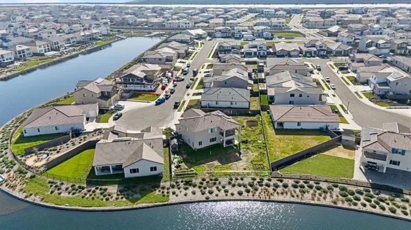 an aerial view of a house with a ocean view