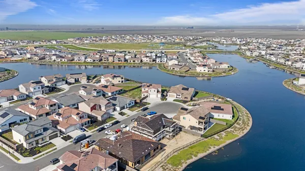 an aerial view of a residential building with outdoor space