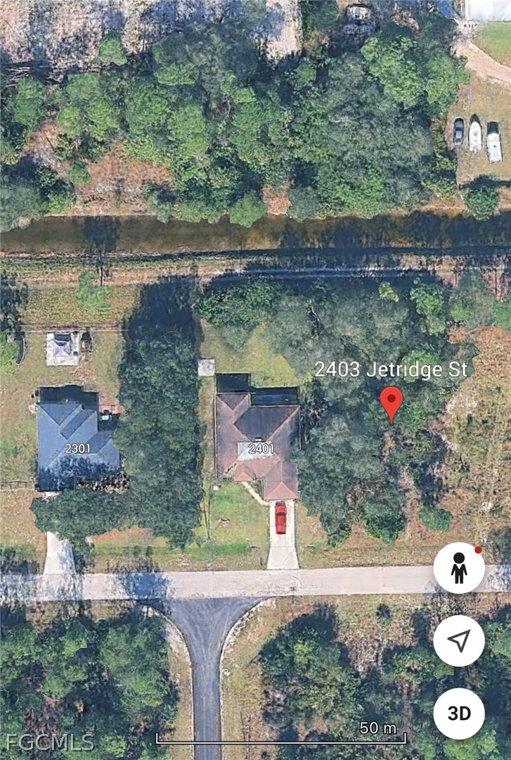 2403 Jetridge Street Alva, FL 33920 - Photo 1 of 6 an aerial view of a house with a yard