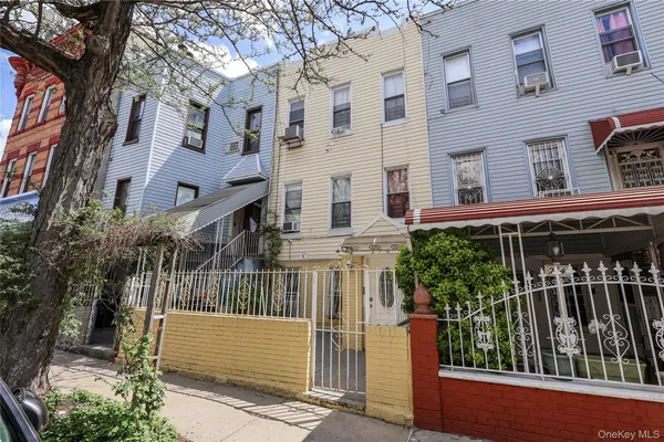 a view of a house with brick walls