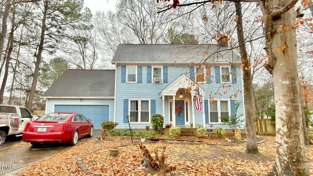 a front view of a house with parking space