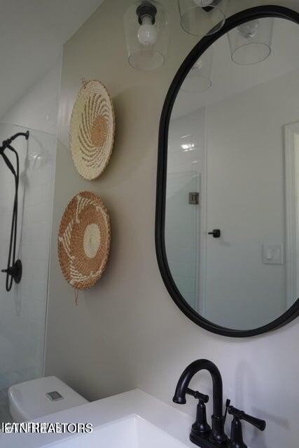 228 Brampton Road Knoxville, TN 37934 - Photo 15 of 23 a bathroom with a sink and a mirror