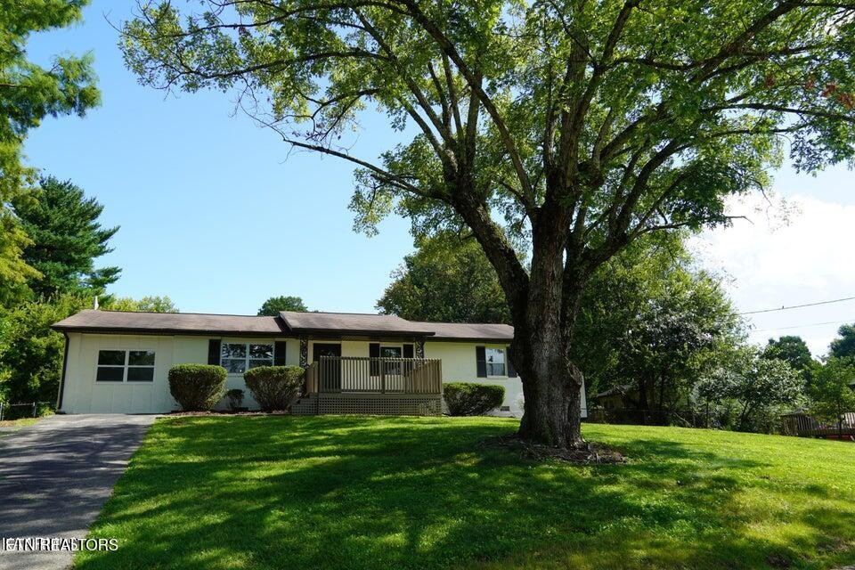 228 Brampton Road Knoxville, TN 37934 - Photo 2 of 23 a front view of a house with a garden
