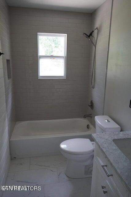 228 Brampton Road Knoxville, TN 37934 - Photo 21 of 23 a bathroom with a granite countertop toilet a sink and bathtub