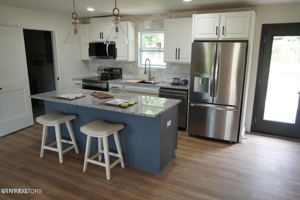 228 Brampton Road Knoxville, TN 37934 - Photo 3 of 23 a kitchen with stainless steel appliances granite countertop a refrigerator a stove a sink and a microwave