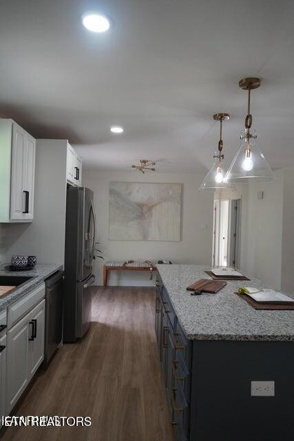228 Brampton Road Knoxville, TN 37934 - Photo 7 of 23 a kitchen with granite countertop a sink cabinets and stainless steel appliances