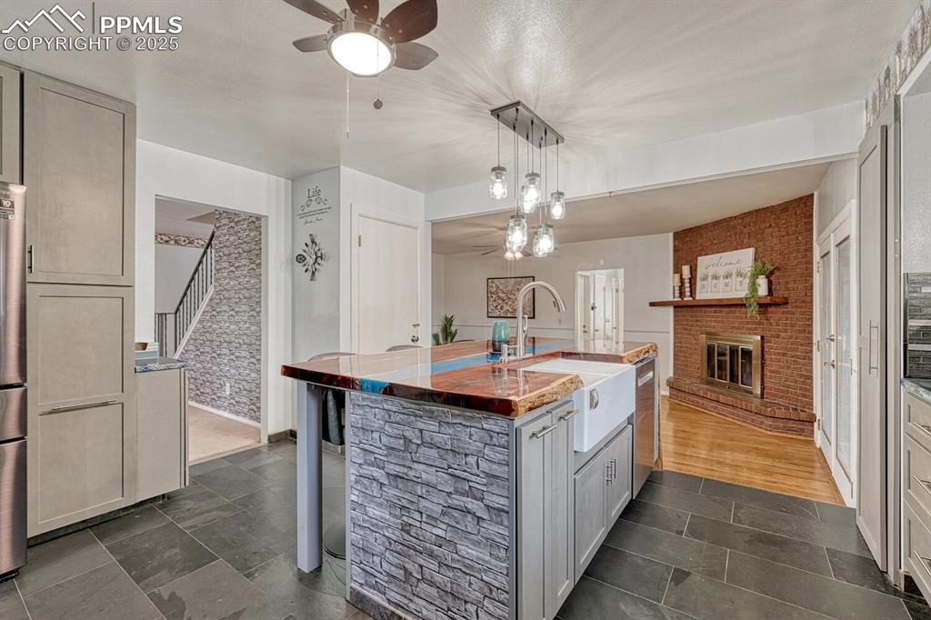 4307 Valli Vista Road Colorado Springs, CO 80915 - Photo 17 of 47 a kitchen with stainless steel appliances granite countertop a sink and stove