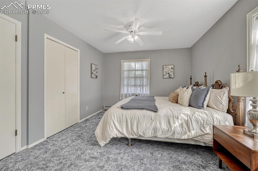 4307 Valli Vista Road Colorado Springs, CO 80915 - Photo 28 of 47 a bedroom with a bed and window