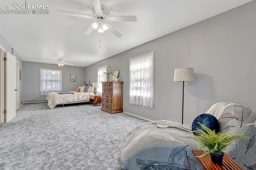 4307 Valli Vista Road Colorado Springs, CO 80915 - Photo 30 of 47 a living room with furniture and a chandelier