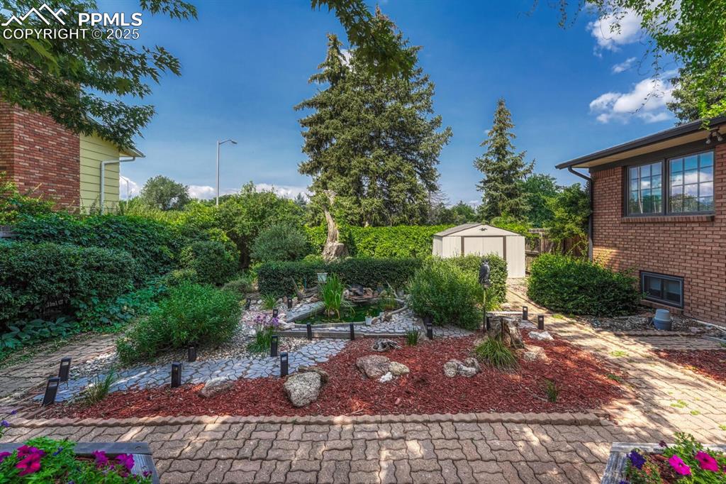 4307 Valli Vista Road Colorado Springs, CO 80915 - Photo 35 of 47 a view of a patio with table and chairs and potted plants